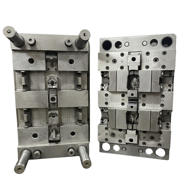 Completed pump housing mould open showing side-action slides and textured cavity surfaces